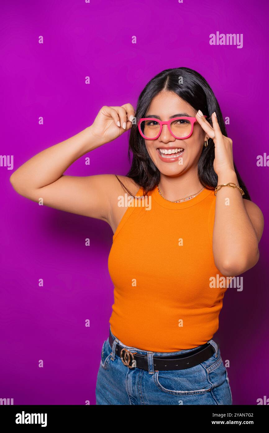 Woman wearing pink top jeans hi-res stock photography and images - Alamy