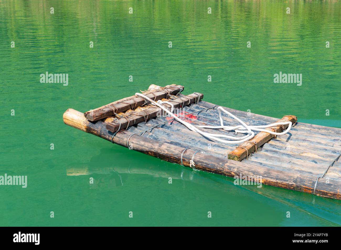 a bamboo raft paddling on the river Stock Photo - Alamy
