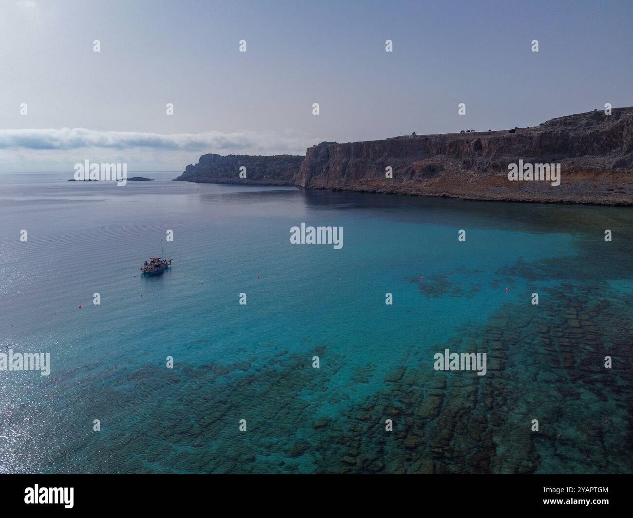 Rhodes, Greece, 12 October 2024. In an aerial view a boat sails in the turquoise waters of the “Bay of Navarone”. The bay got its name from the movie “The Guns of Navarone” that was shot there in 1961. Credit: Dimitris Aspiotis/Alamy Stock Photo