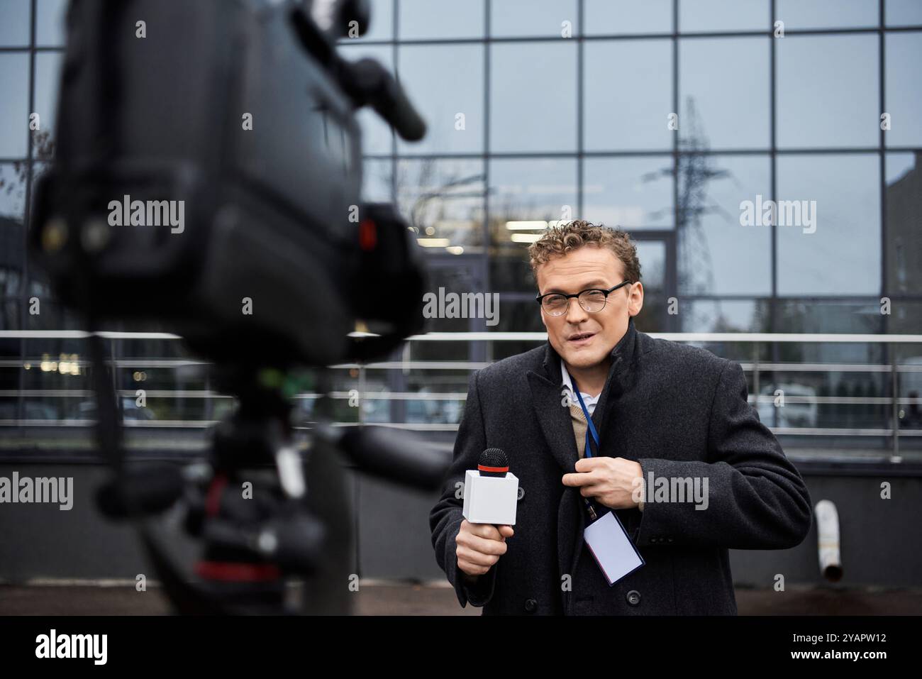A dedicated journalist wearing glasses delivers important news updates ...