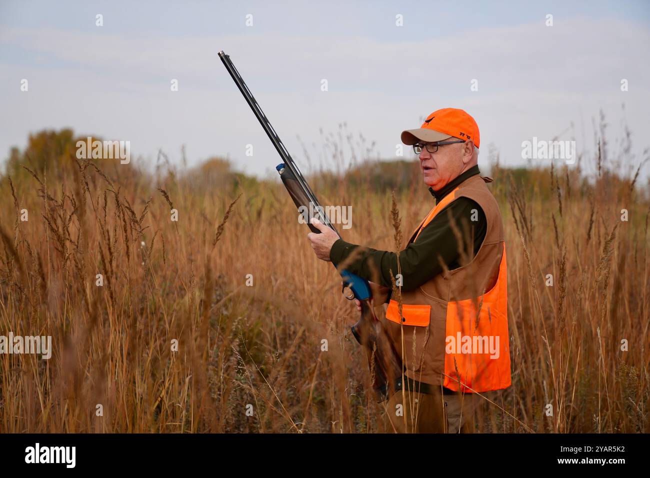 Sleepy Eye, United States of America. 12 October, 2024. Minnesota Governor and Democratic Vice Presidential candidate Tim Walz, D-MN, holding a Beretta A400 shotgun during the opening hunt of Pheasant season, October 12, 2024 near Sleepy Eye, Minnesota.  Credit: MNGOV/Minnesota Governors Office/Alamy Live News Stock Photo