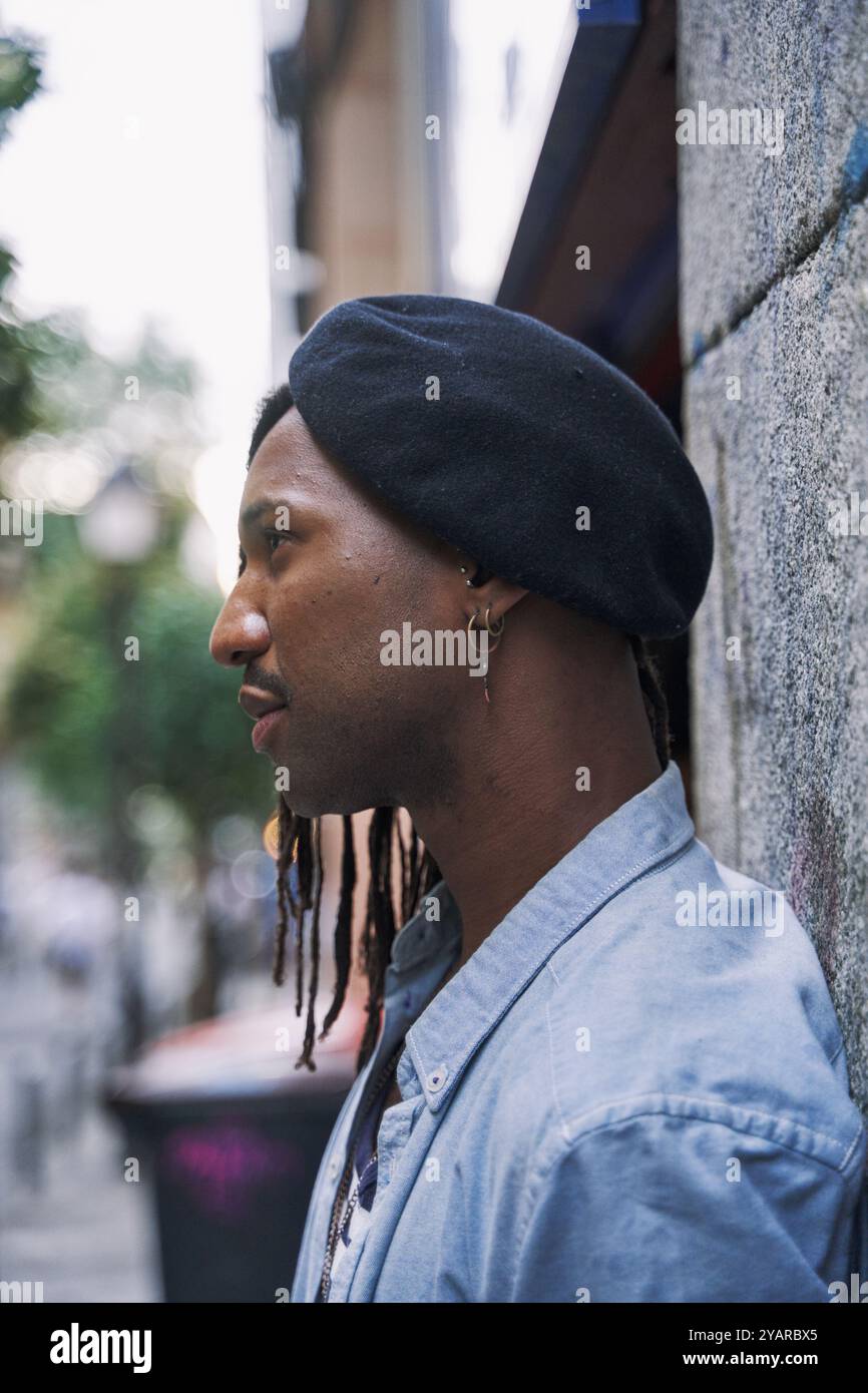 Young man dreadlocks black hat hi-res stock photography and images - Alamy
