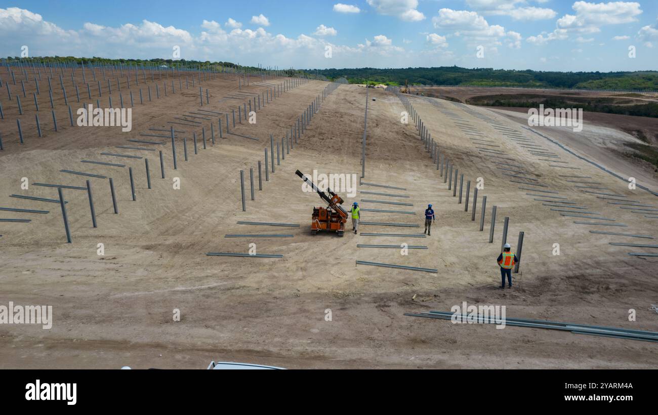 Drone picture of mens working in a modern utility scale solar farm ...