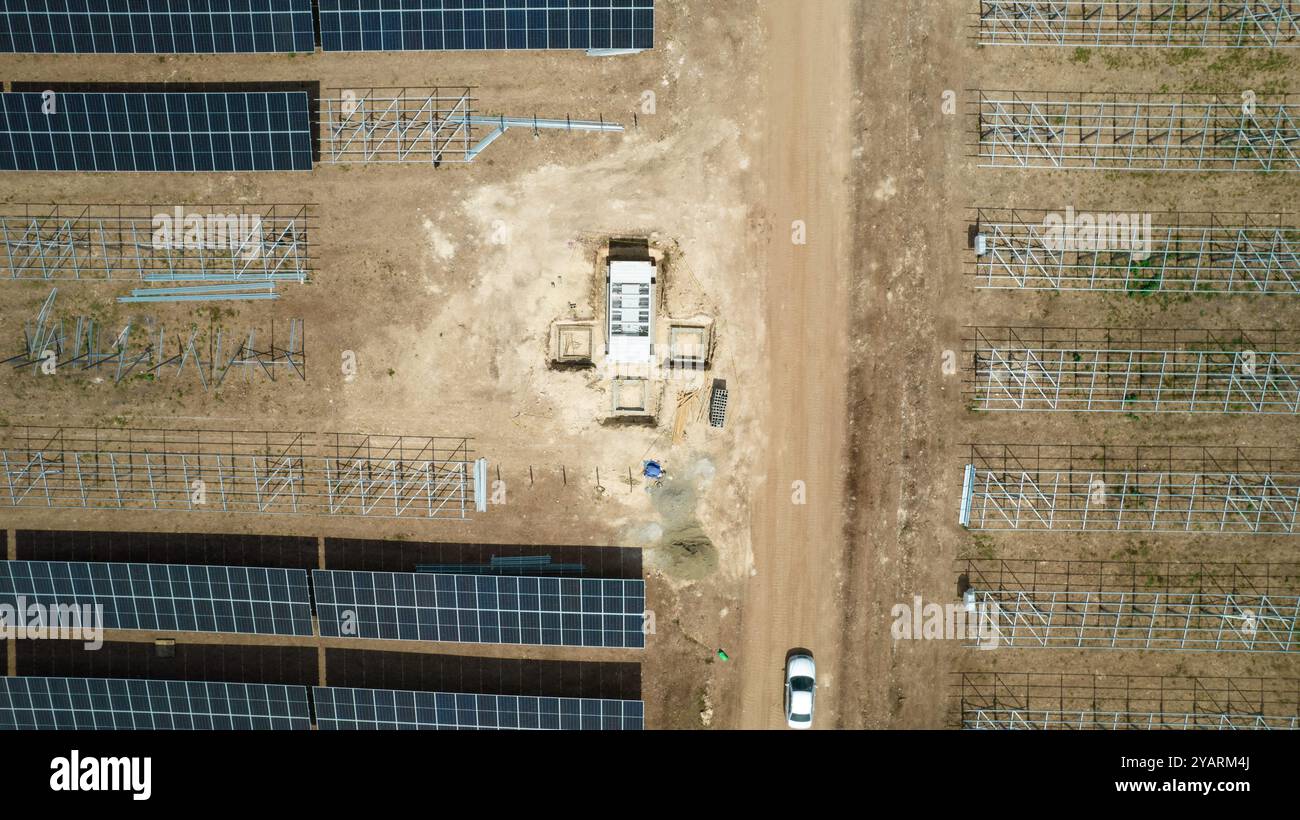 Drone picture of mens working in a modern utility scale solar farm ...
