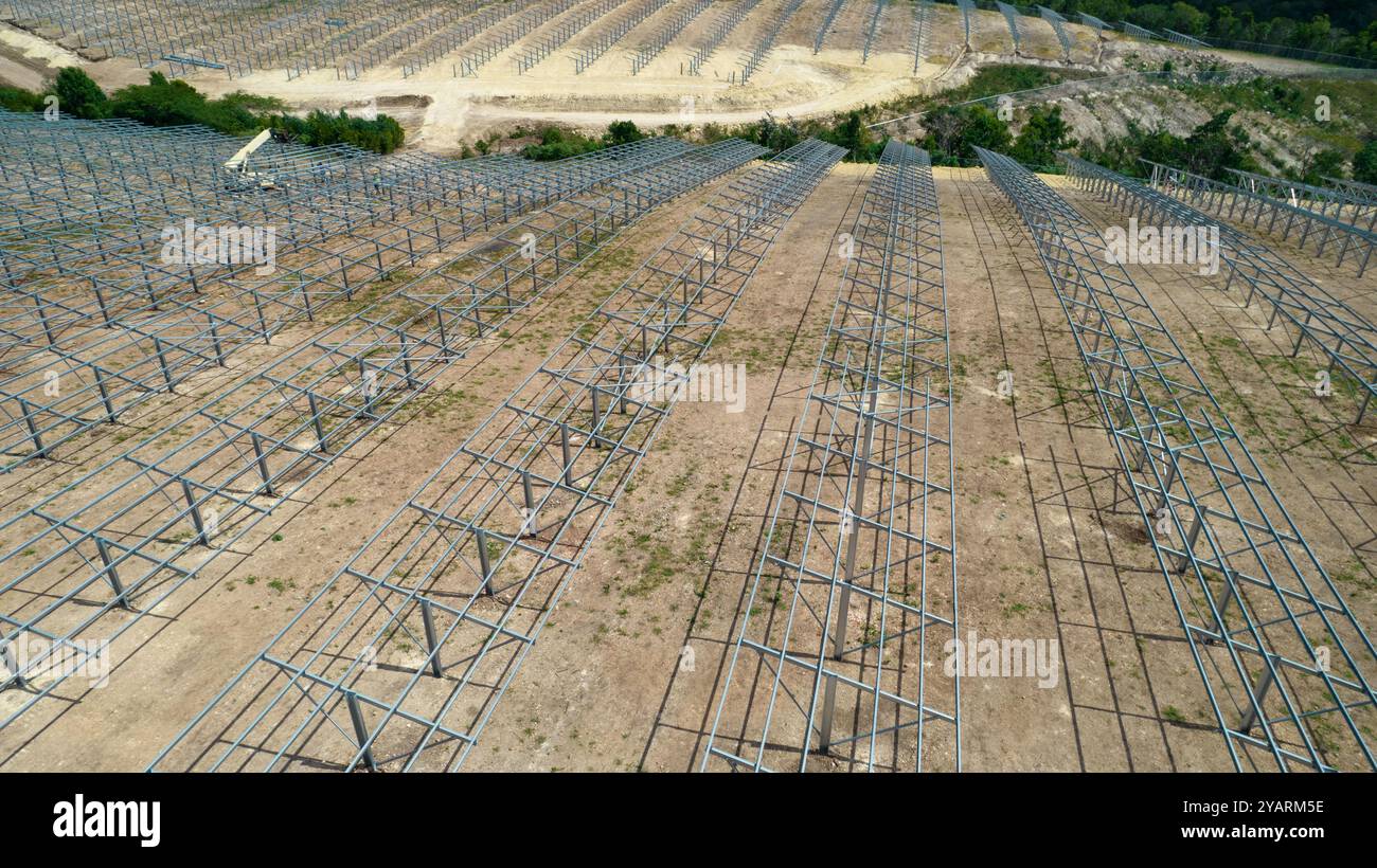 Drone picture of mens working in a modern utility scale solar farm ...