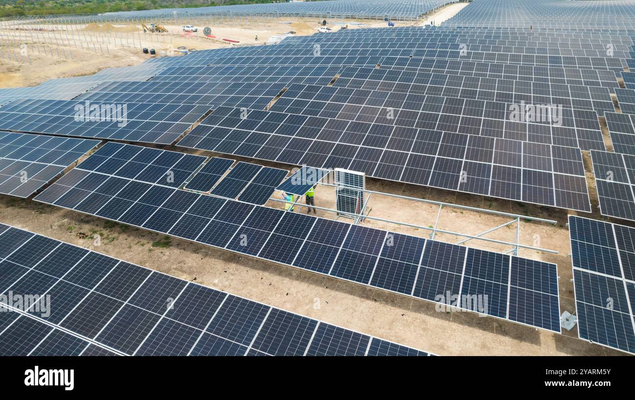 Drone picture of mens working in a modern utility scale solar farm ...