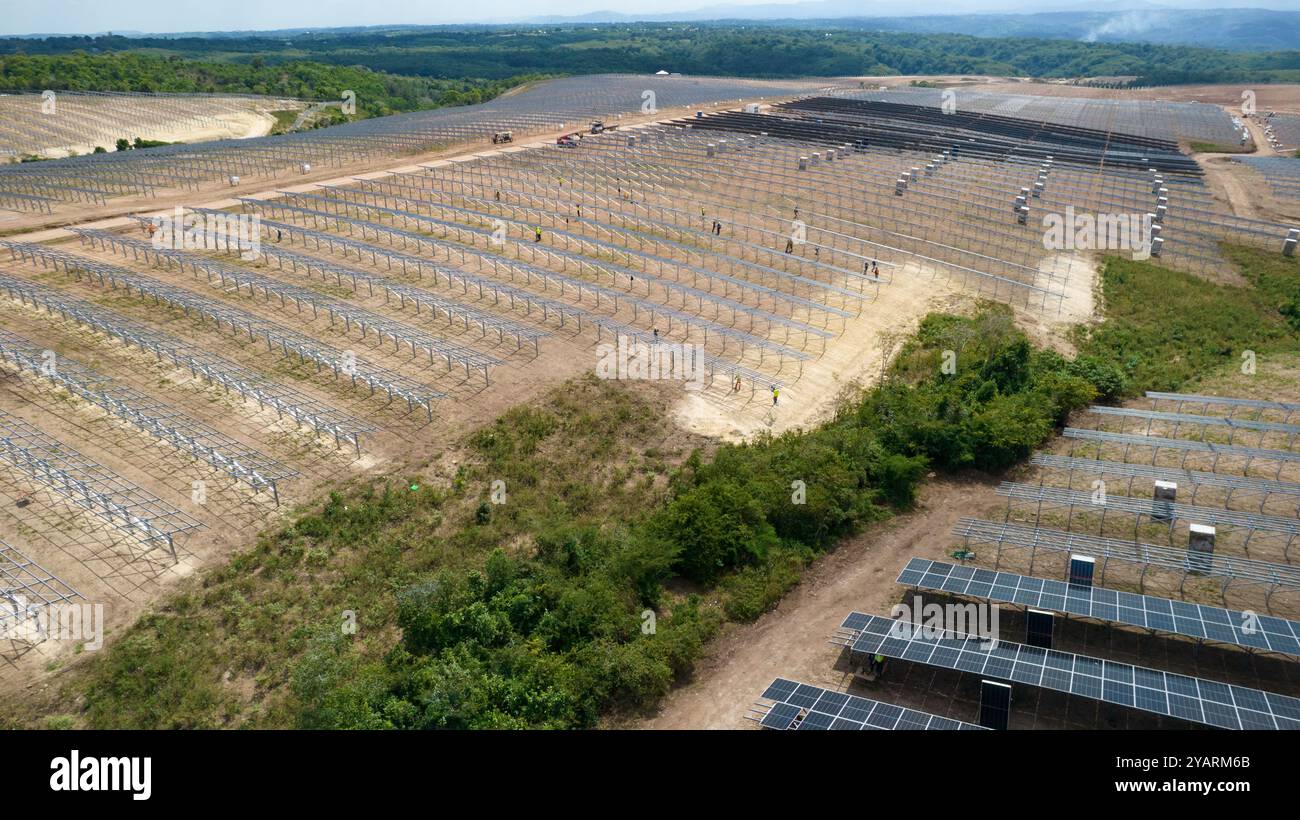 Drone picture of mens working in a modern utility scale solar farm ...