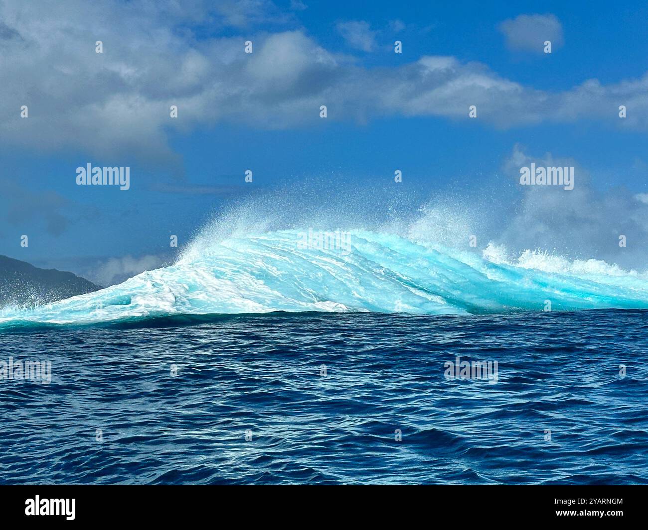 A wave crashing at Teahupo'o, Tahiti, French Polynesia, the venue for the 2024 Olympics surfing event. - Smartphone Captured Stock Image