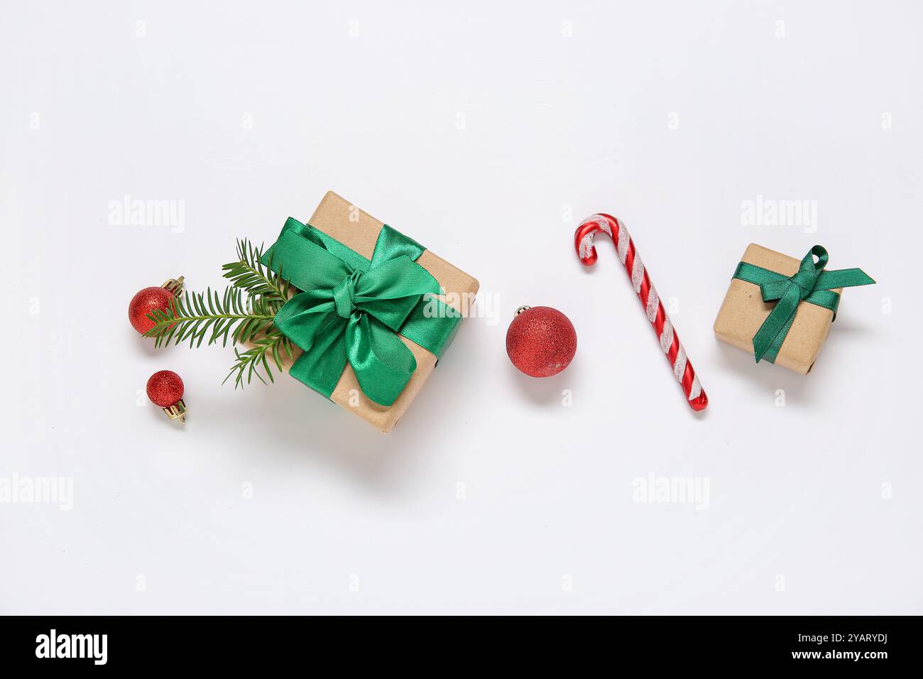 Christmas balls, gift boxes and candy cane on white background Stock ...