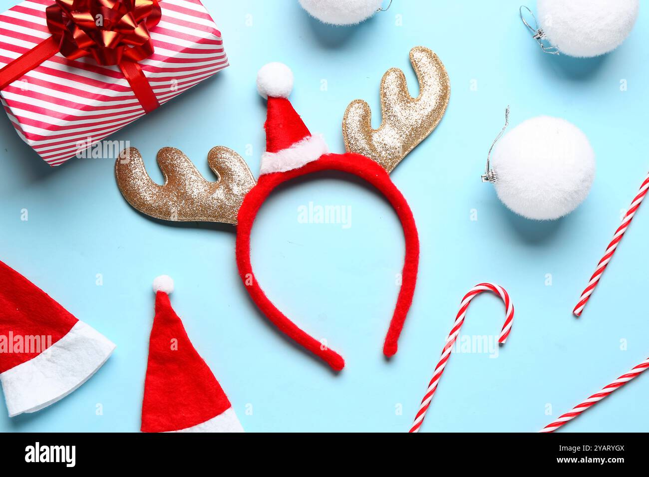 Cute reindeer horns with Santa hats, Christmas balls, gift box and ...