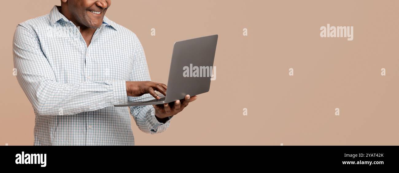 African man technology typing hi-res stock photography and images - Alamy