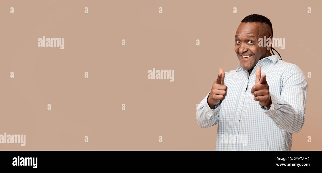 Middle aged african man pointing at camera Stock Photo