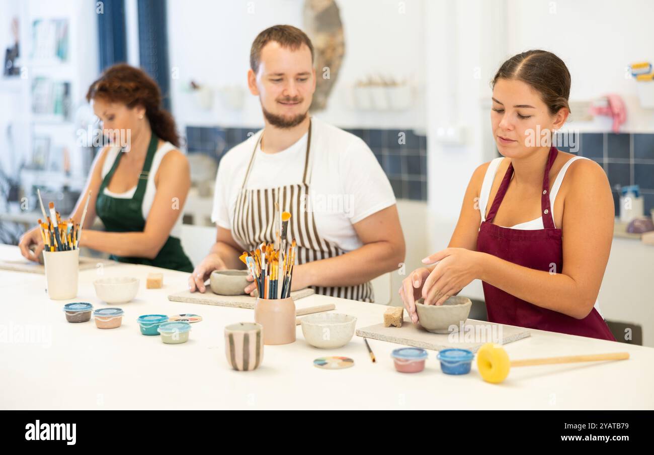 Three students in pottery hi-res stock photography and images - Alamy