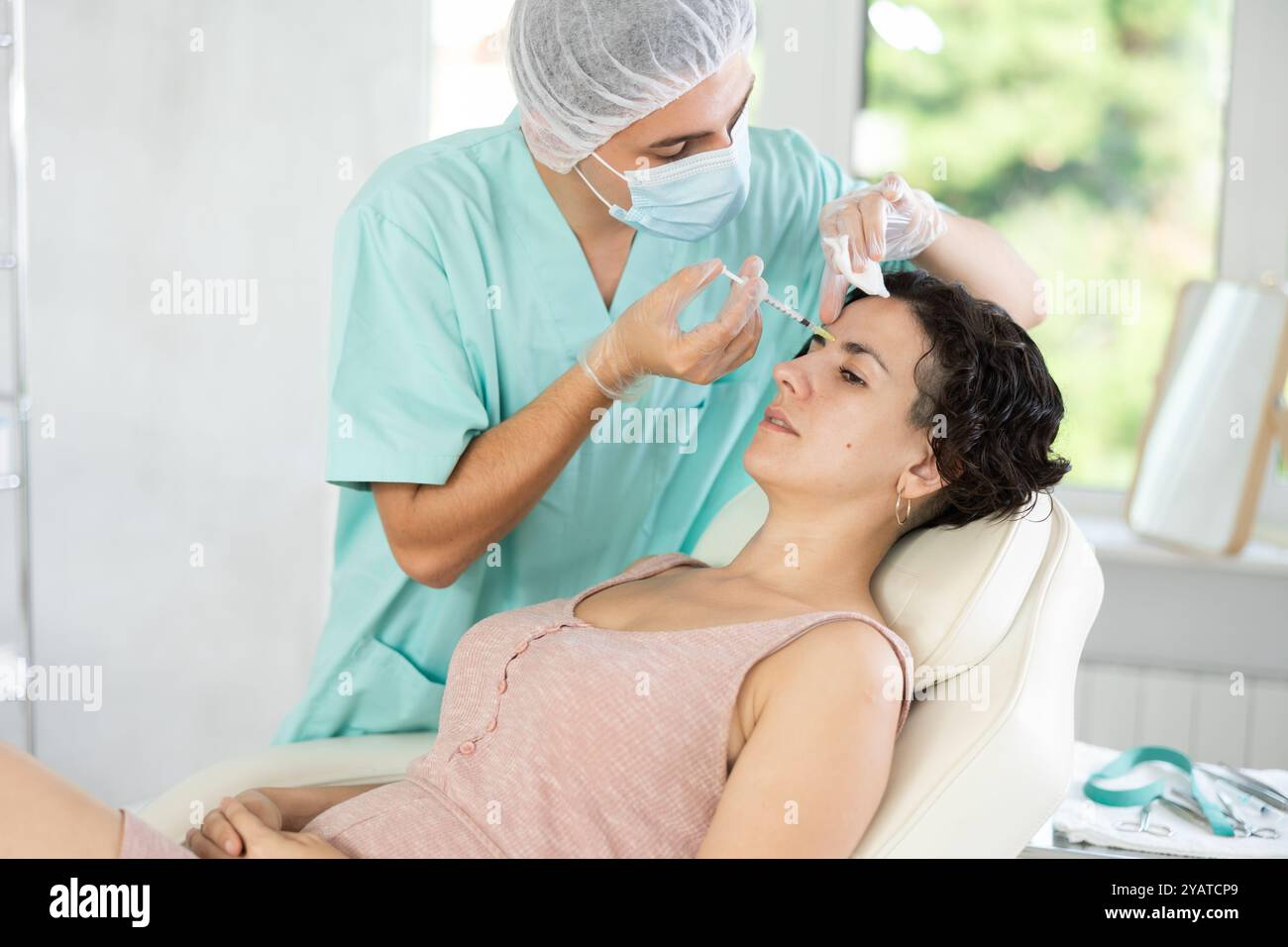 Fifmal Injection Facial injection female patient Stock Photo - Alamy