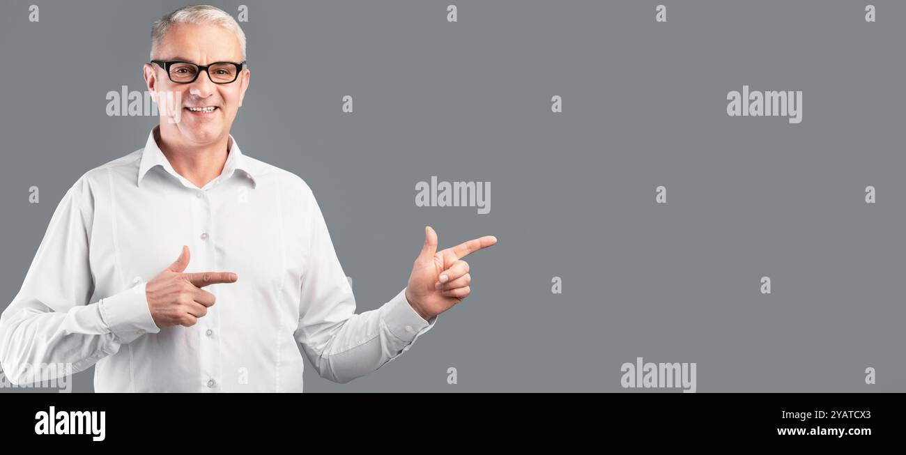 Man pointing fingers smiling hi-res stock photography and images - Alamy
