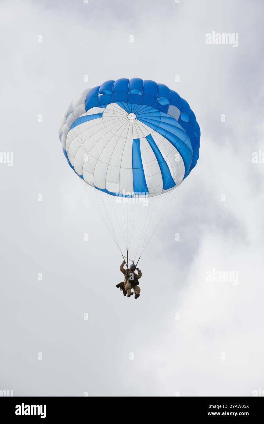 A Forest Service smokejumper (Chris Young) descends towards the landing zone on a practice jump, Missoula, MT. Stock Photo