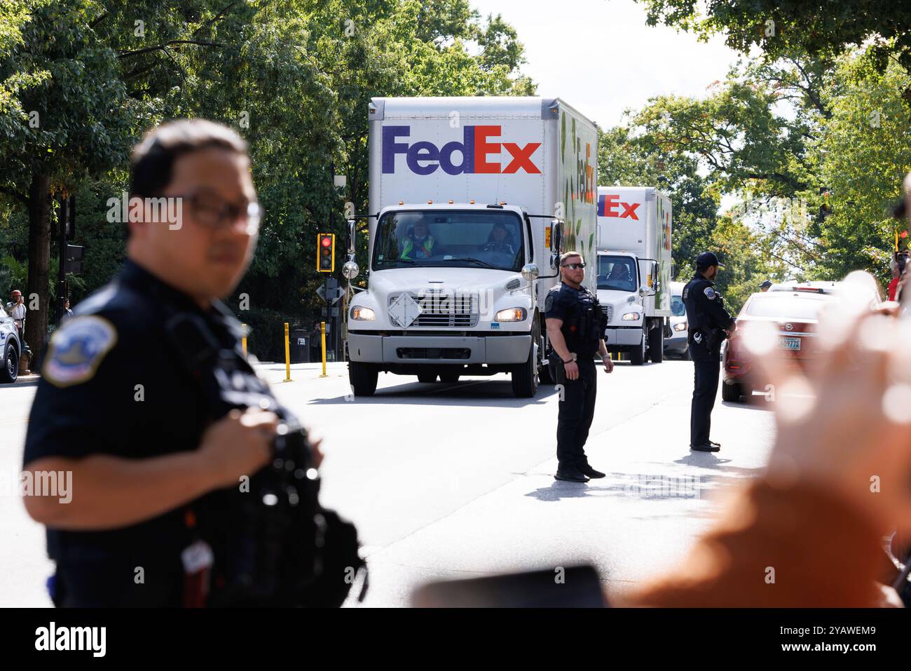 Washington, USA. 16th Oct, 2024. Trucks carrying pandas arrive at the Smithsonian's National Zoo and Conservation Biology Institute in Washington, DC, the United States, Oct. 15, 2024. A pair of giant pandas, Bao Li and Qing Bao, arrived at Washington, DC on Tuesday, after an approximately 19-hour trans-Pacific trip from Sichuan Province in southwest China. Credit: Aaron Schwartz/Xinhua/Alamy Live News Stock Photo