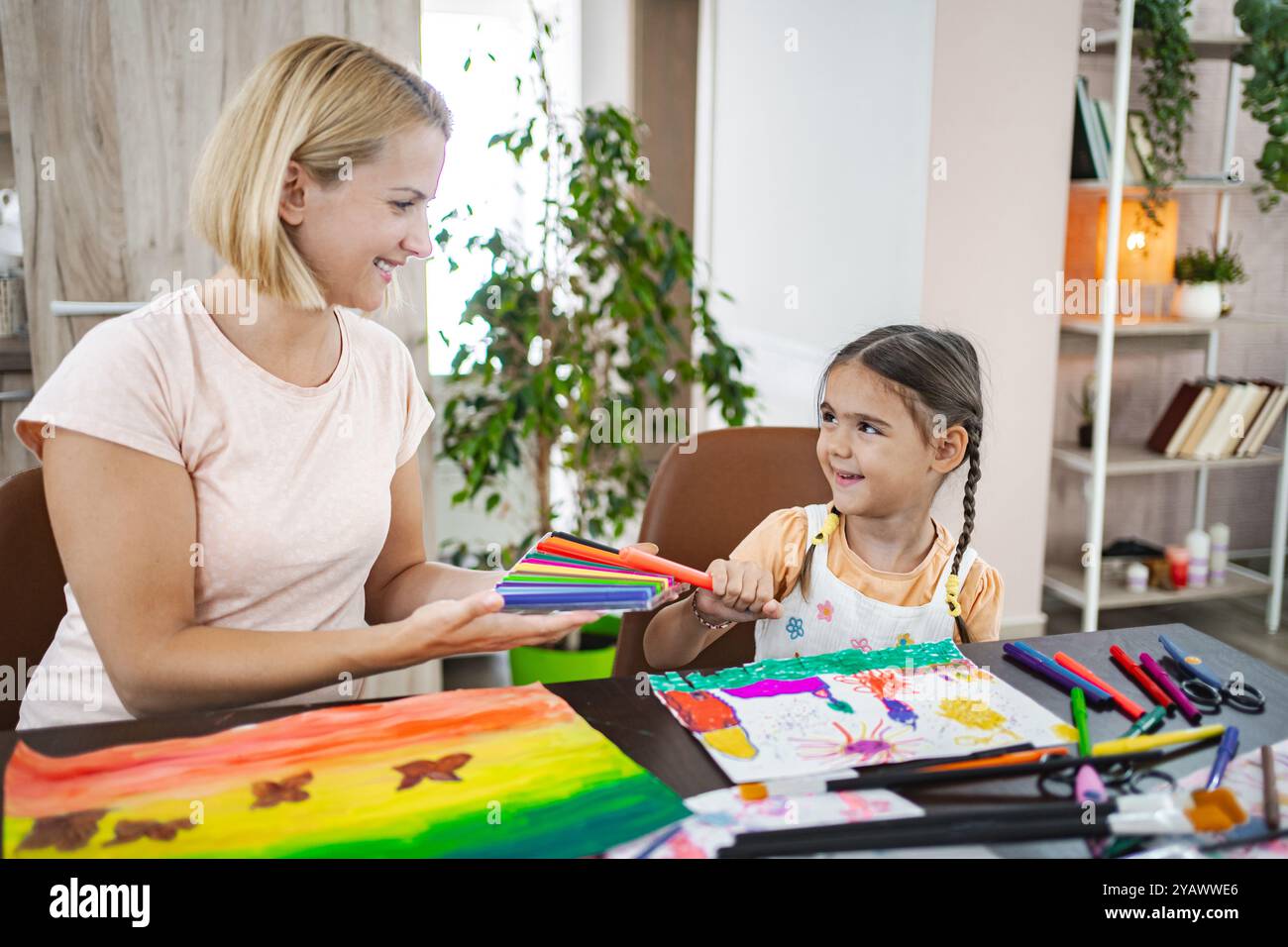 Mother and daughter engaged in creative art activity Stock Photo - Alamy