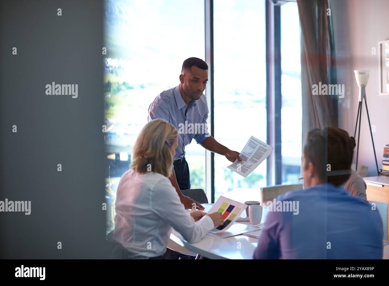 Business, people and meeting with paperwork in office for discussion ...
