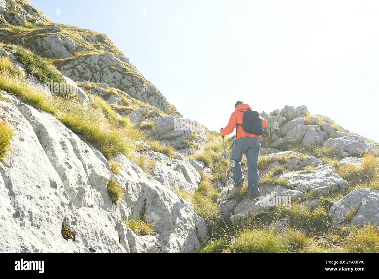 Man hikes up slope hi-res stock photography and images - Alamy
