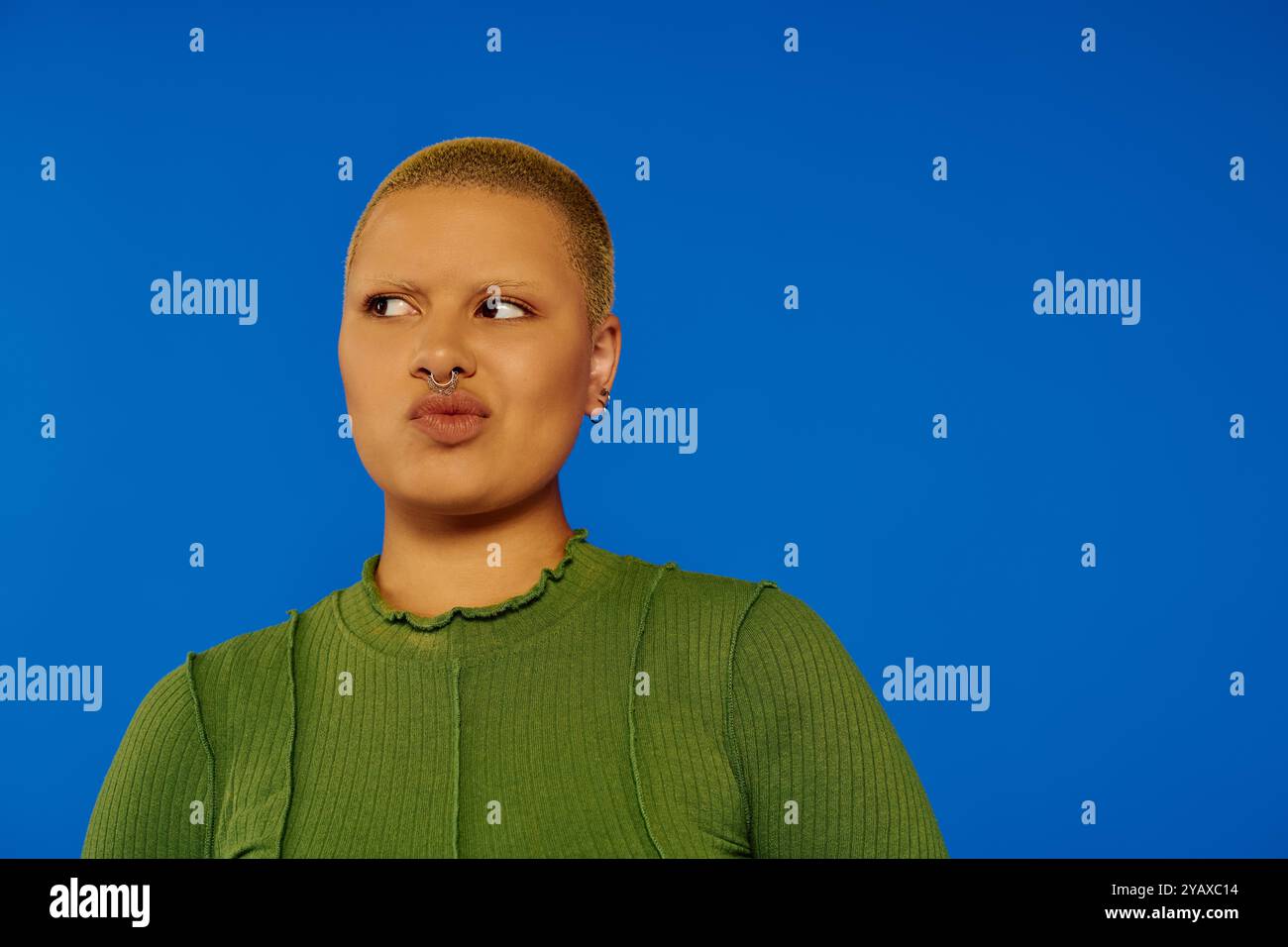 A young woman showcases her bold fashion sense with a distinctive look ...