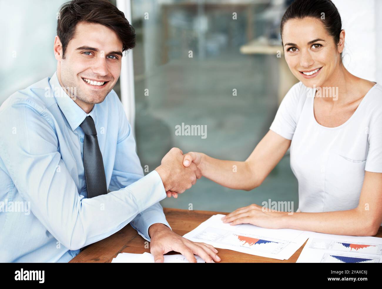 Business people, meeting and handshake in portrait with graphs ...