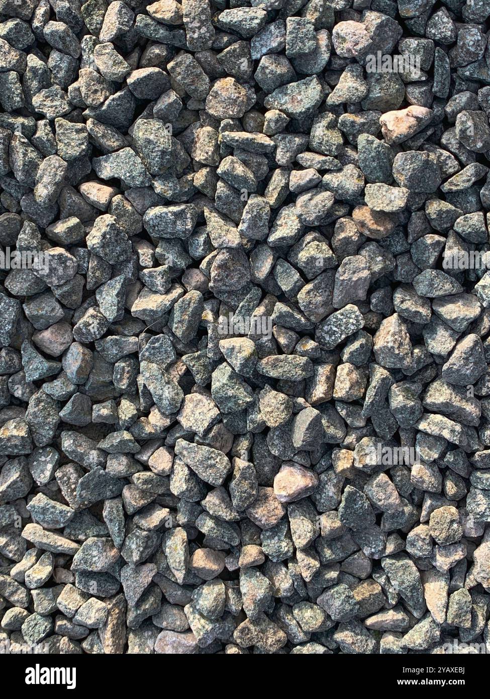 Granite chippings hard landscaping surface full frame background texture. A mobile phone photo with some phone or tablet post processing. - Smartphone Captured Stock Image