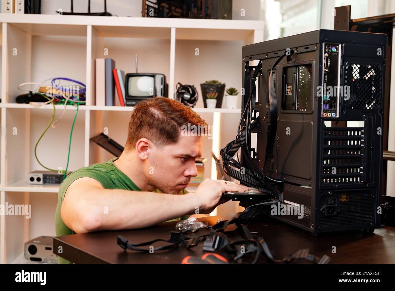 Dman Reparing Computer Close up of man repairing computer system unit Stock Photo - Alamy