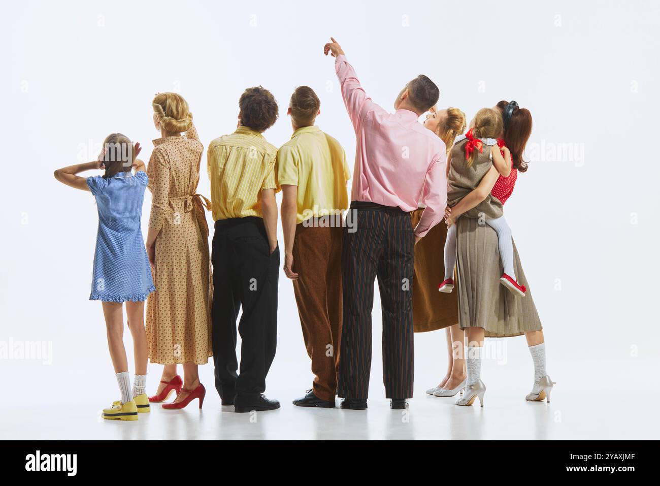 Rear view of the group, with everyone gazing upwards emphasizing unity ...