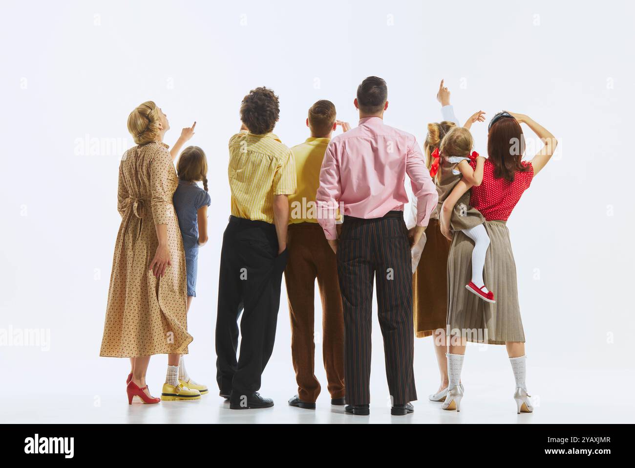 Rear view of the group, with everyone gazing upwards emphasizing unity ...