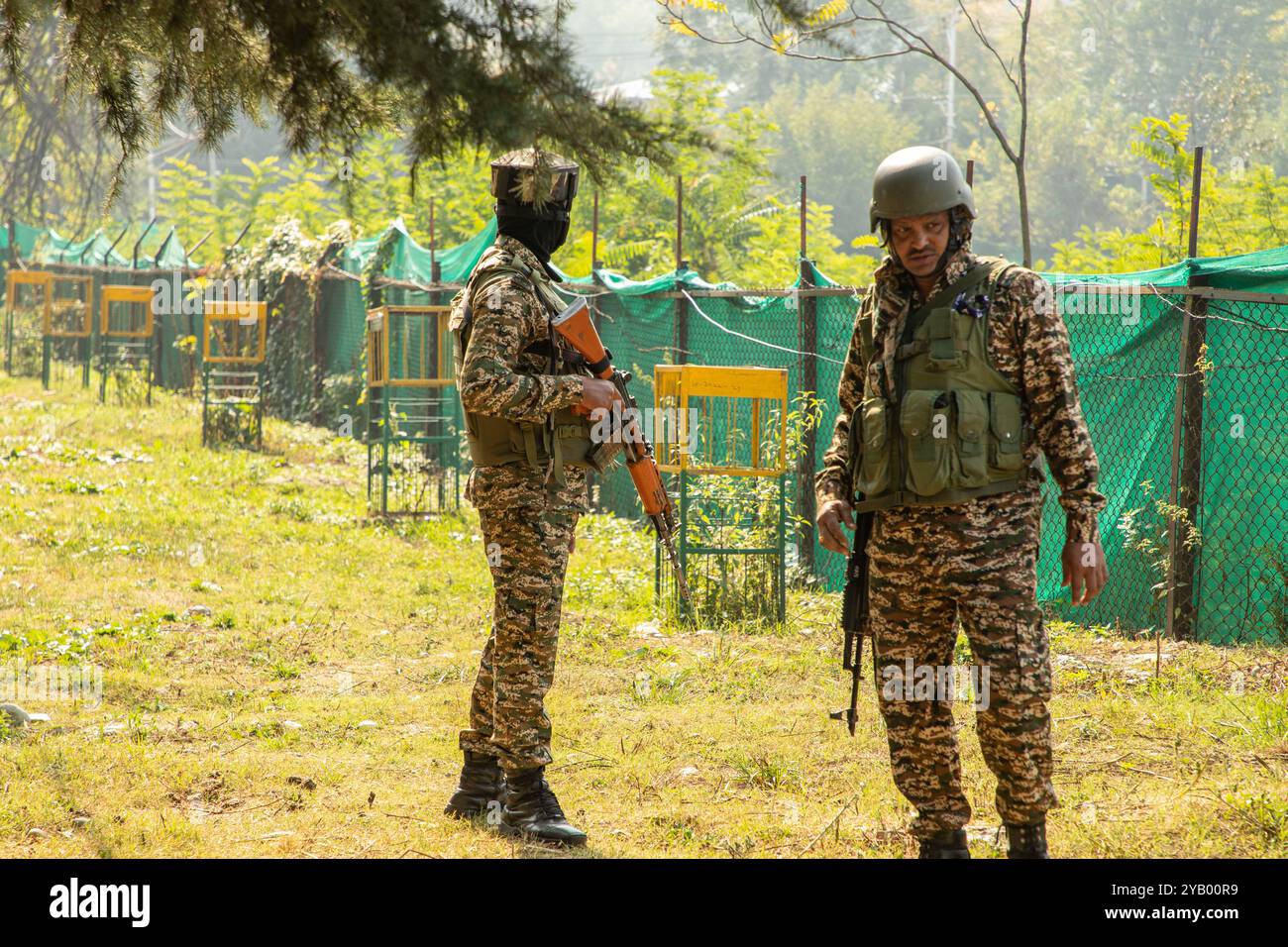 Indian paramilitary soldiers stand on alert near the venue where Omar ...