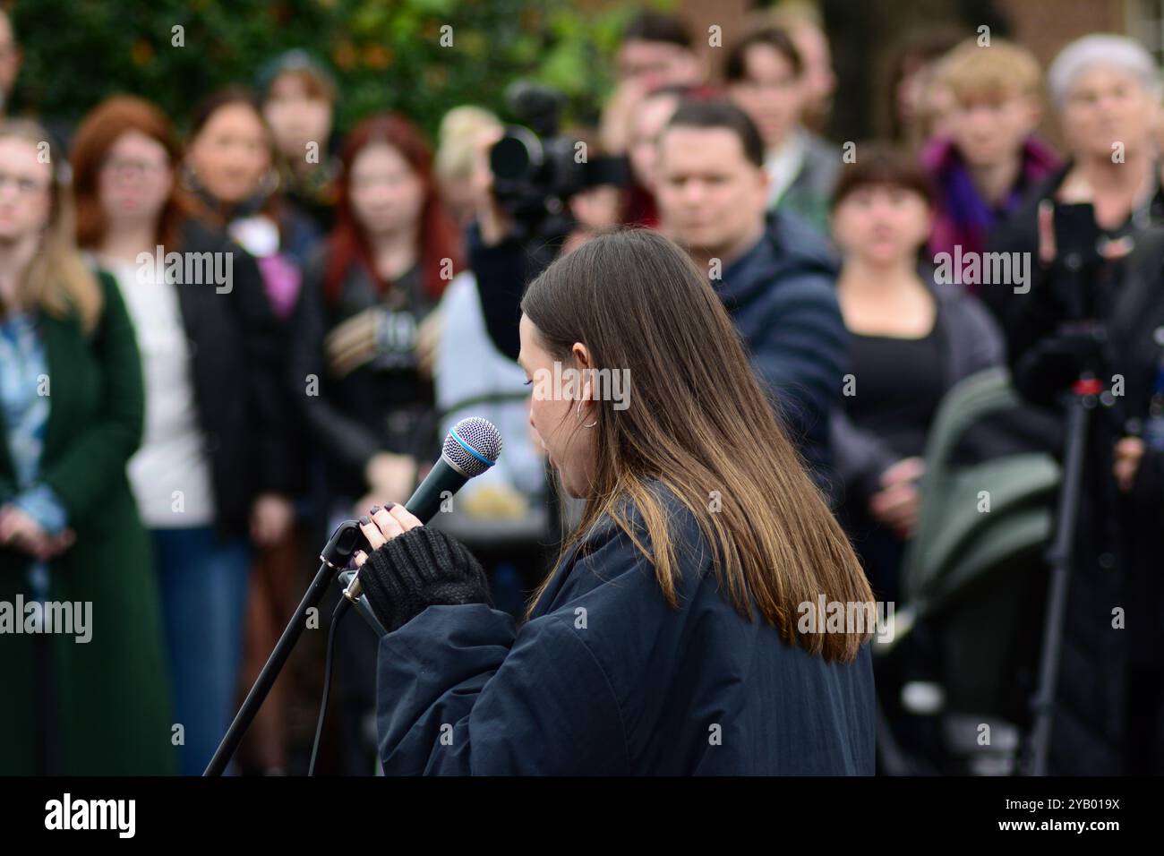 Belfast, United Kingdom 16/10/2024 Fiona Ferguson from People Before Profit speaks to crowd of protesters gathered at Queens University. Protest at Queens University Belfast organised by ROSA NI to protest the rise in femicide cases in Northern Ireland Belfast Northern Ireland credit:HeadlineX/Alamy Live News Stock Photo