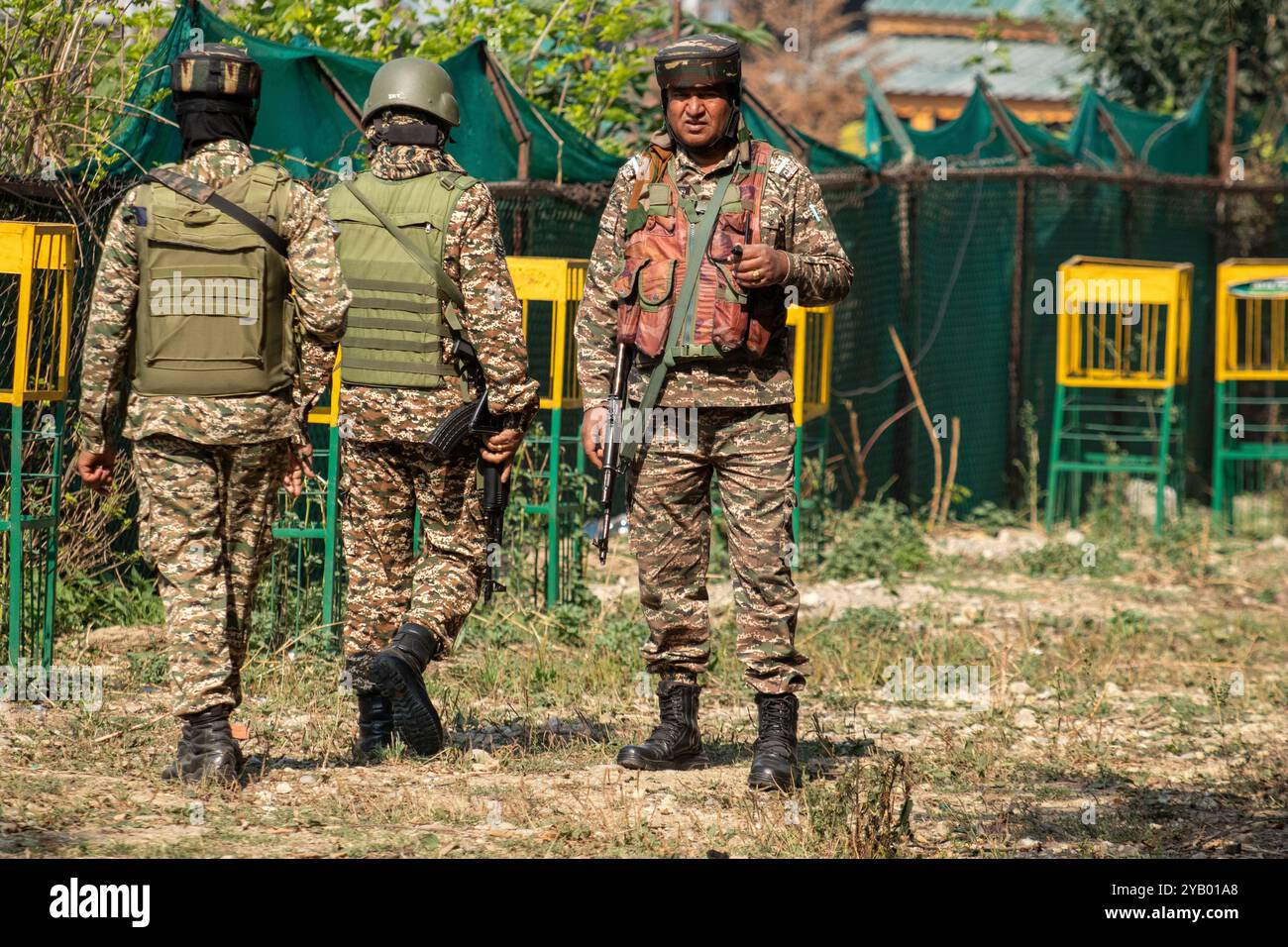 Indian paramilitary soldiers stand on alert near the venue where Omar ...