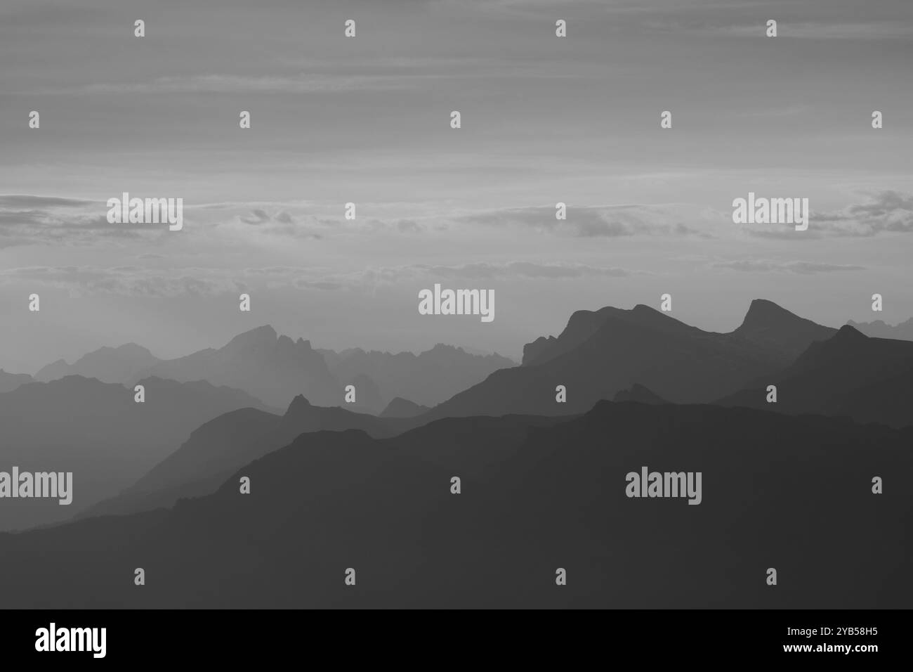 Monochrome image of mountain ranges in the Bernese Oberland seen from Niesen Kulm Stock Photo
