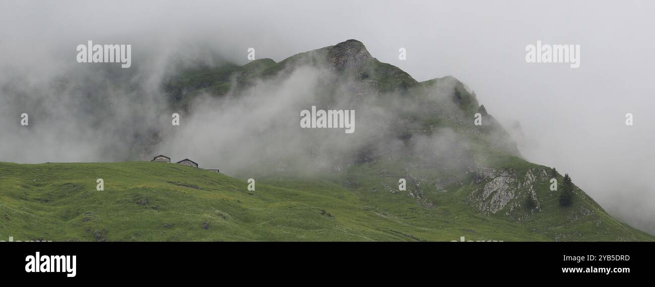 Fog creeping over mountains hi-res stock photography and images - Alamy