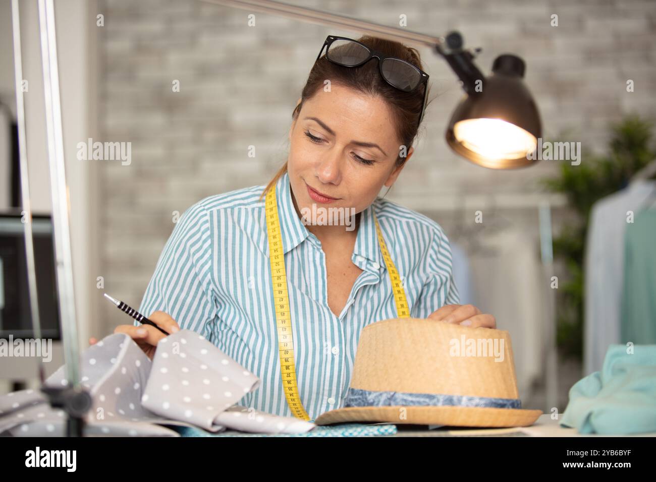hat designer working in studio Stock Photo