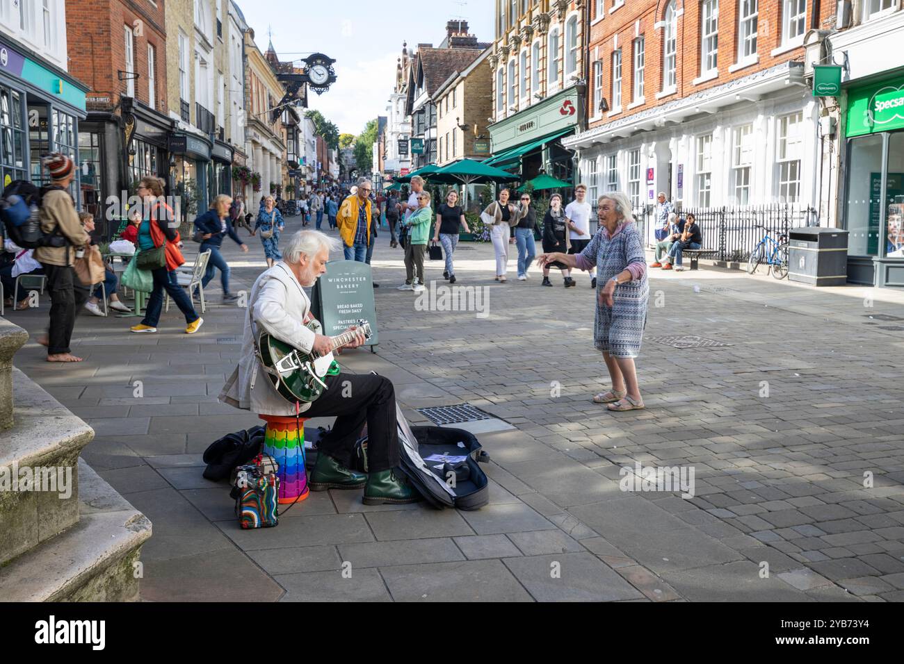 Busker on the busy High Street, Winchester, Hampshire, England, United Kingdom, Europe Stock Photo