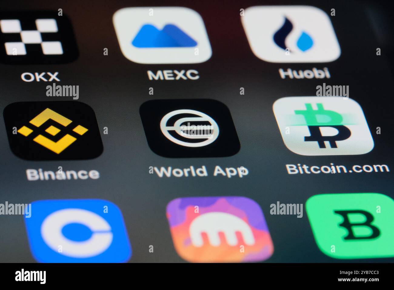 World App (Worldcoin), Bitcoin, Binance and other cryptocurrency exchange app icons. Stock Photo