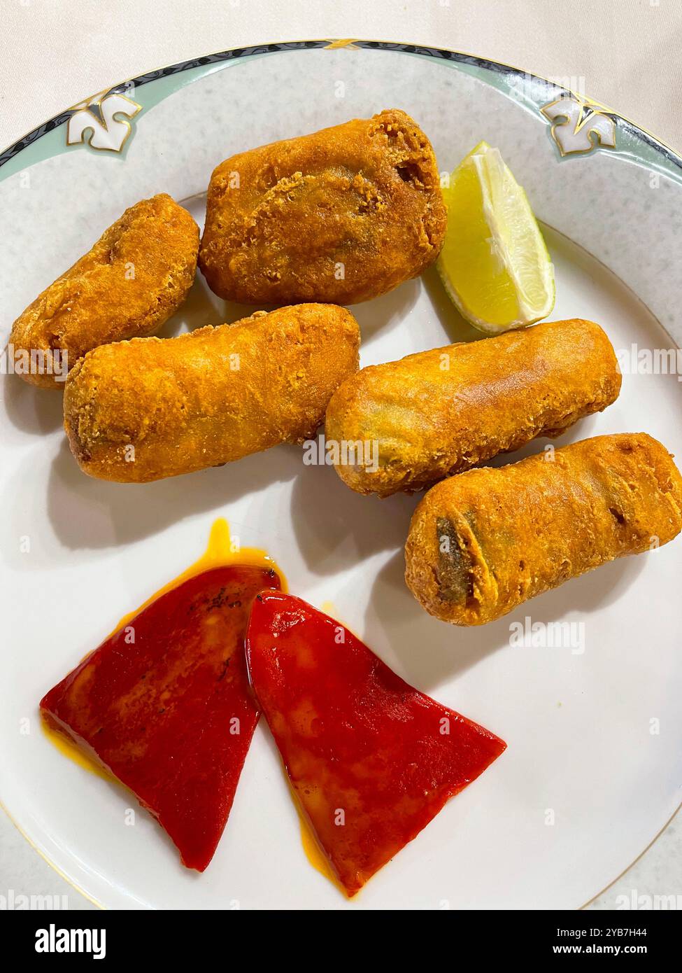 Fried fish with red peppers. - Smartphone Captured Stock Image