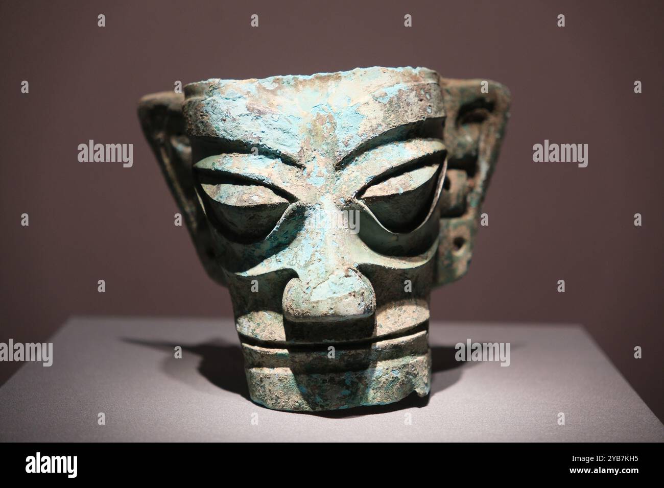 Shanghai,China-March 17th 2024: Sanxingdui Bronze human face mask. Ancient Shang dynasty artifact Stock Photo