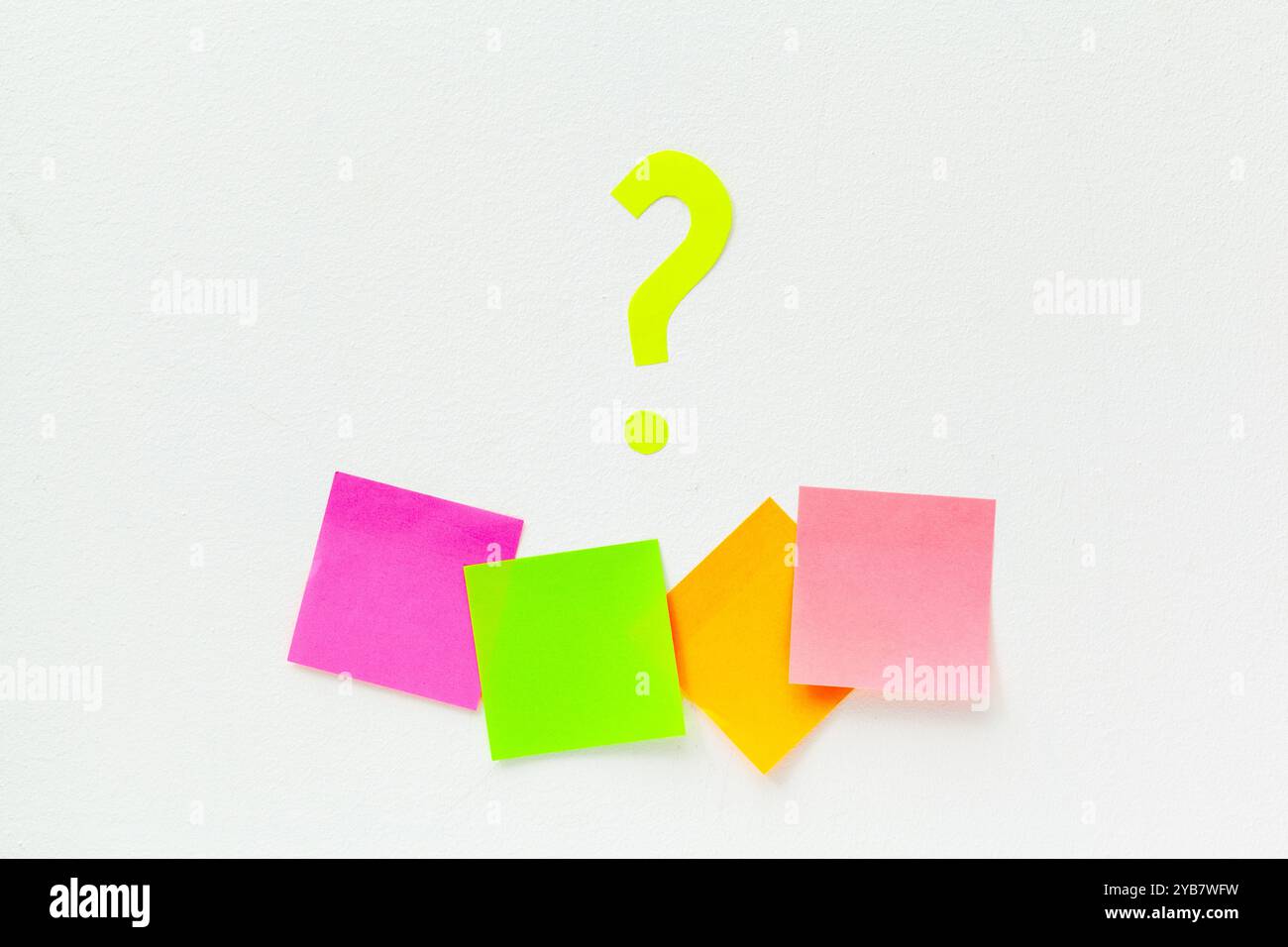 sticky notes with question marks over white Stock Photo