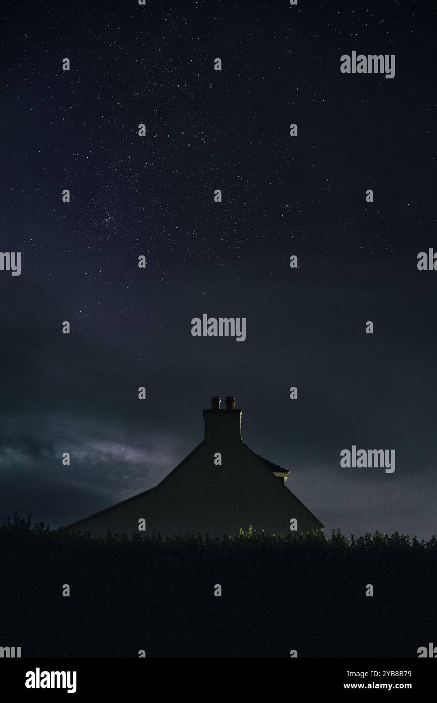 The night starry sky and a lonely house. Isle of Skye, Scotland Stock ...