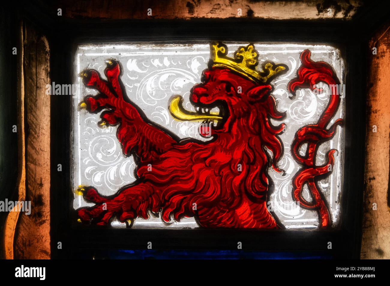 Detail of a stained glass window. A medieval style symbol of a