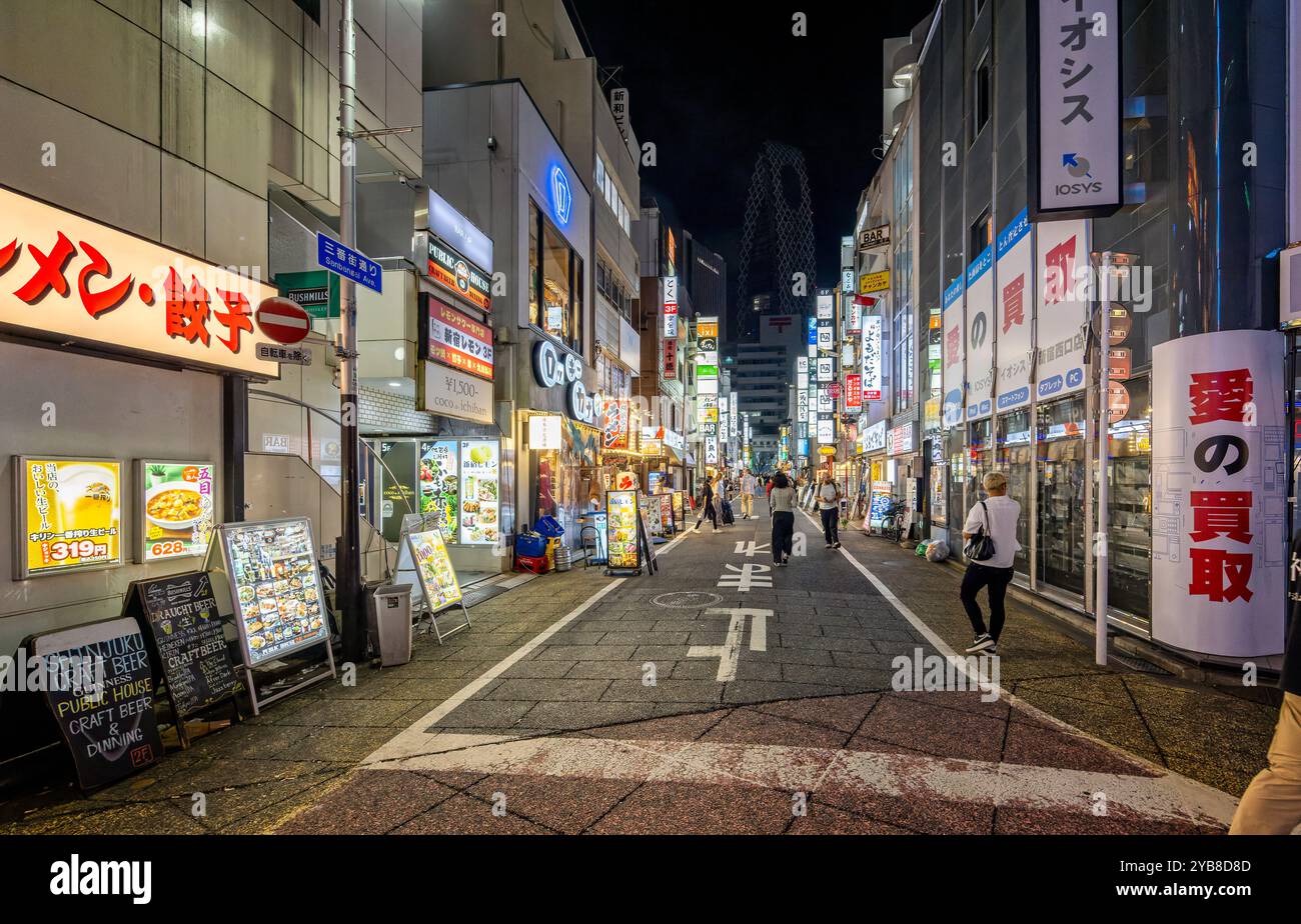 Bright neon lights of shops and restaurants along Sanbangai Avenue in Shinjuku, Tokyo, Japan on 23 September 2023 Stock Photo