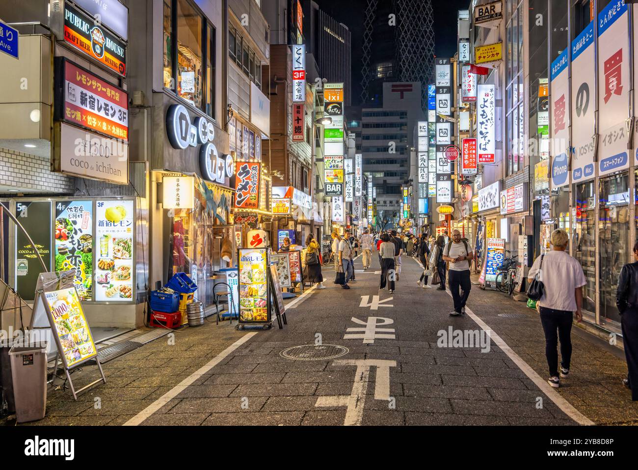 Bright neon lights of shops and restaurants along Sanbangai Avenue in Shinjuku, Tokyo, Japan on 23 September 2023 Stock Photo