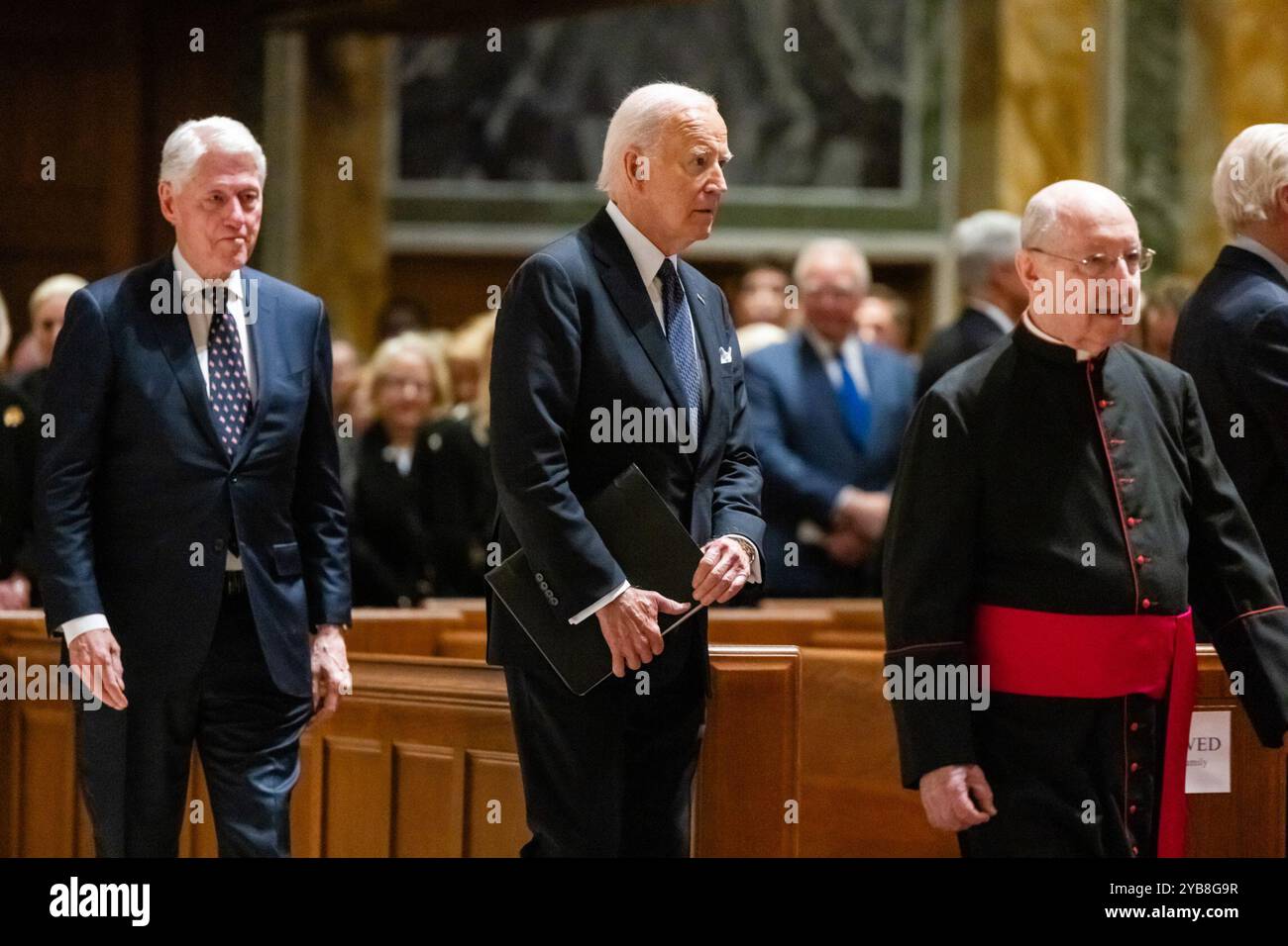 US President Joe Biden (C) arrives to deliver a eulogy at a memorial