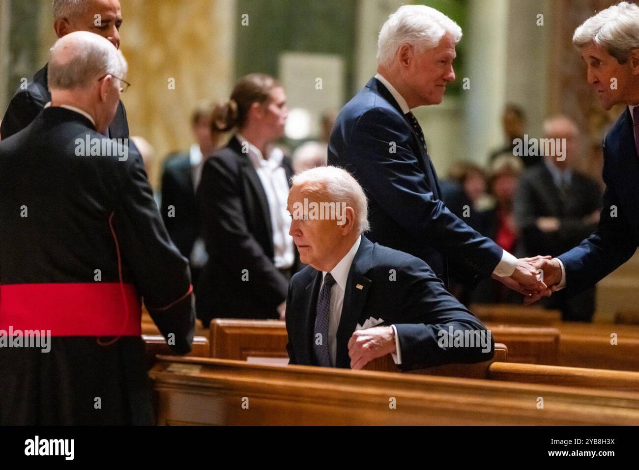 US President Joe Biden (C) arrives to deliver a eulogy at a memorial