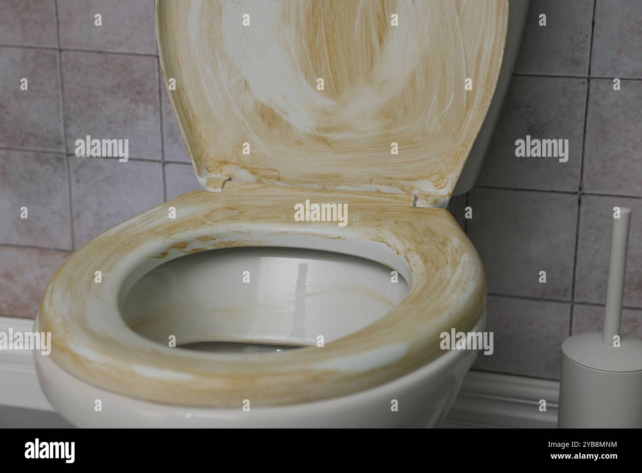 Toilet with dirty seat in public restroom, closeup Stock Photo