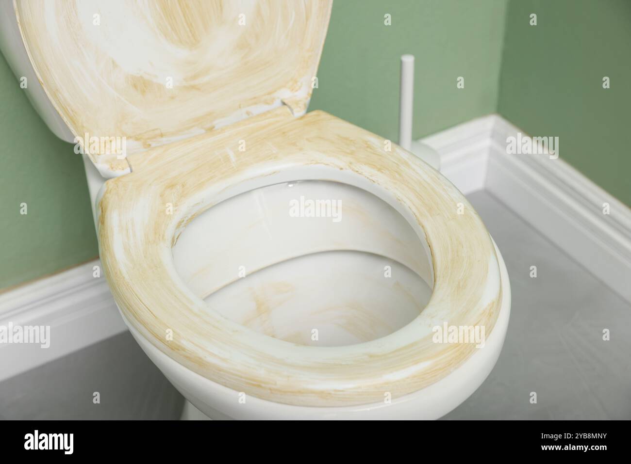 Toilet with dirty seat in public restroom, closeup Stock Photo