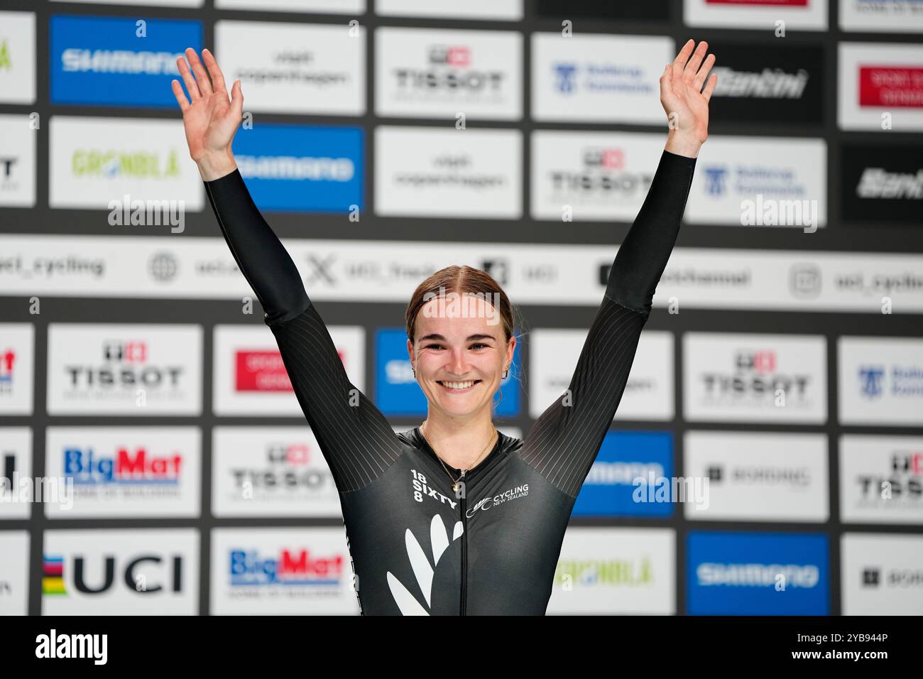 Ally Wollaston, of New Zealand, gestures on the podium after winning ...